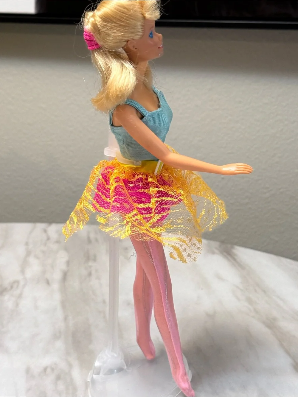 vintage blonde 1998 Bubble Fairy Barbie doll wearing a light blue top and a pink